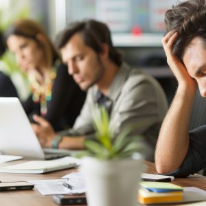 Time Management, Productivity, Employees visibly tired and frustrated during an overly long meeting with no clear agenda