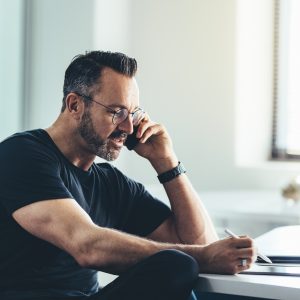 Businessman busy working in office, need to take tomorrow off