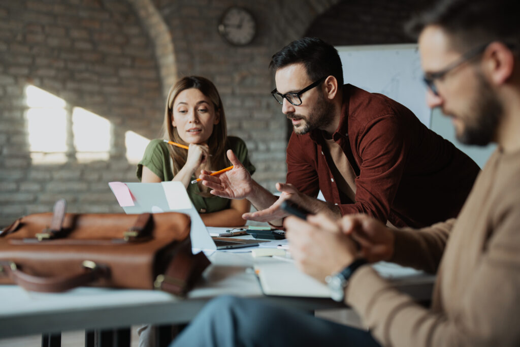 How Successful Business Owners Look at Financial Decisions, Small business group working together in a office space