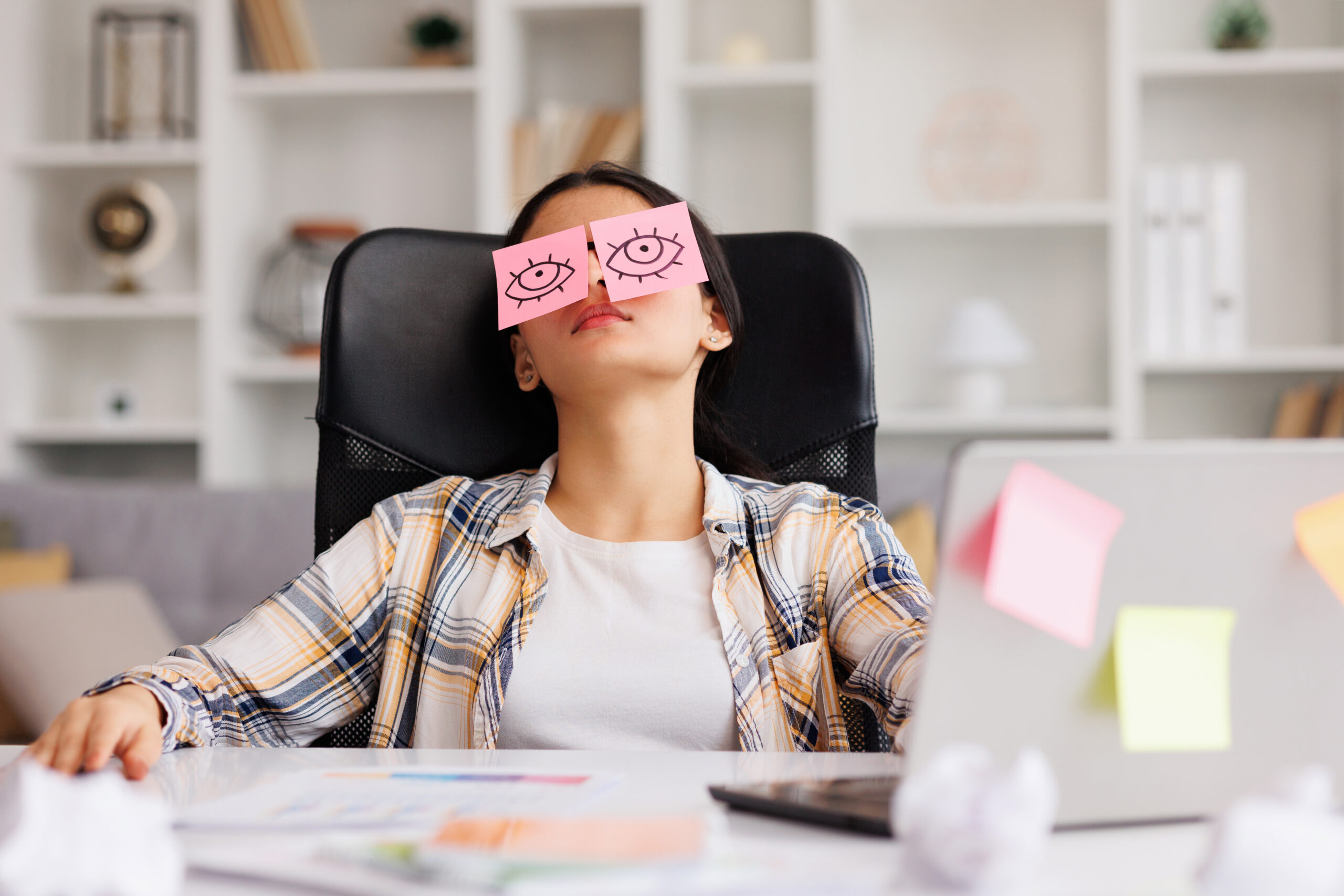 The Top 4 Reasons Why Your Team Blames You for Their Lack of Downtime, The concept of a lot of work, Distracted woman in home office