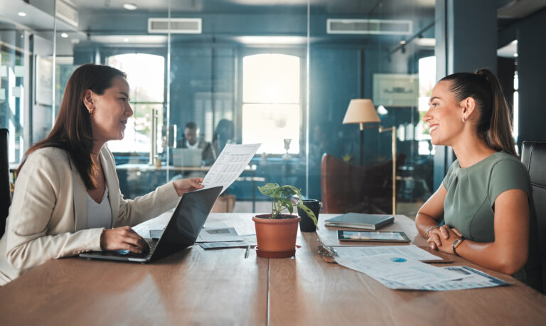 Job interview at a hiring company talking to the HR manager about the role or position, female applicant or candidate in a meeting with an employer having a discussion.