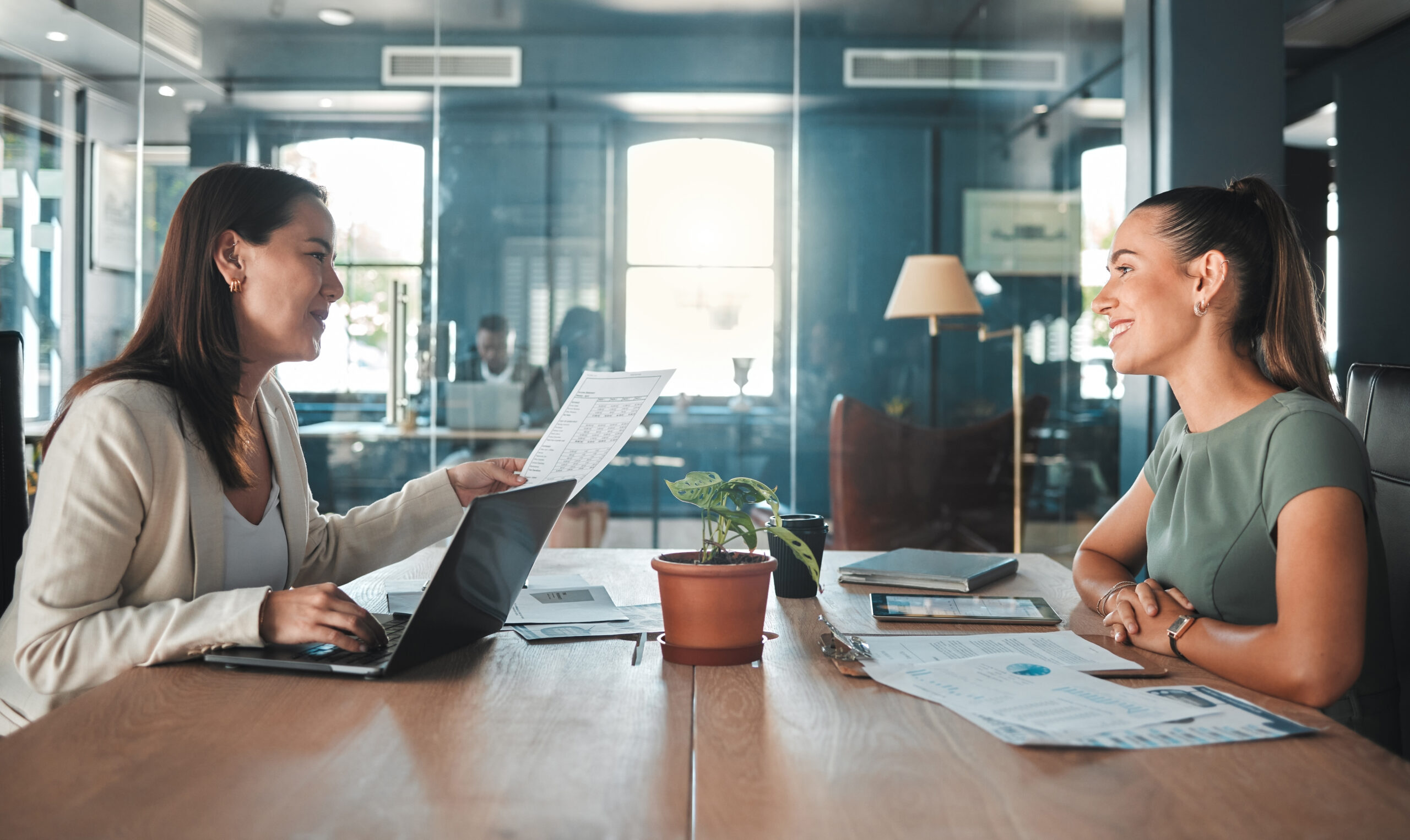 Job interview at a hiring company talking to the HR manager about the role or position, female applicant or candidate in a meeting with an employer having a discussion.