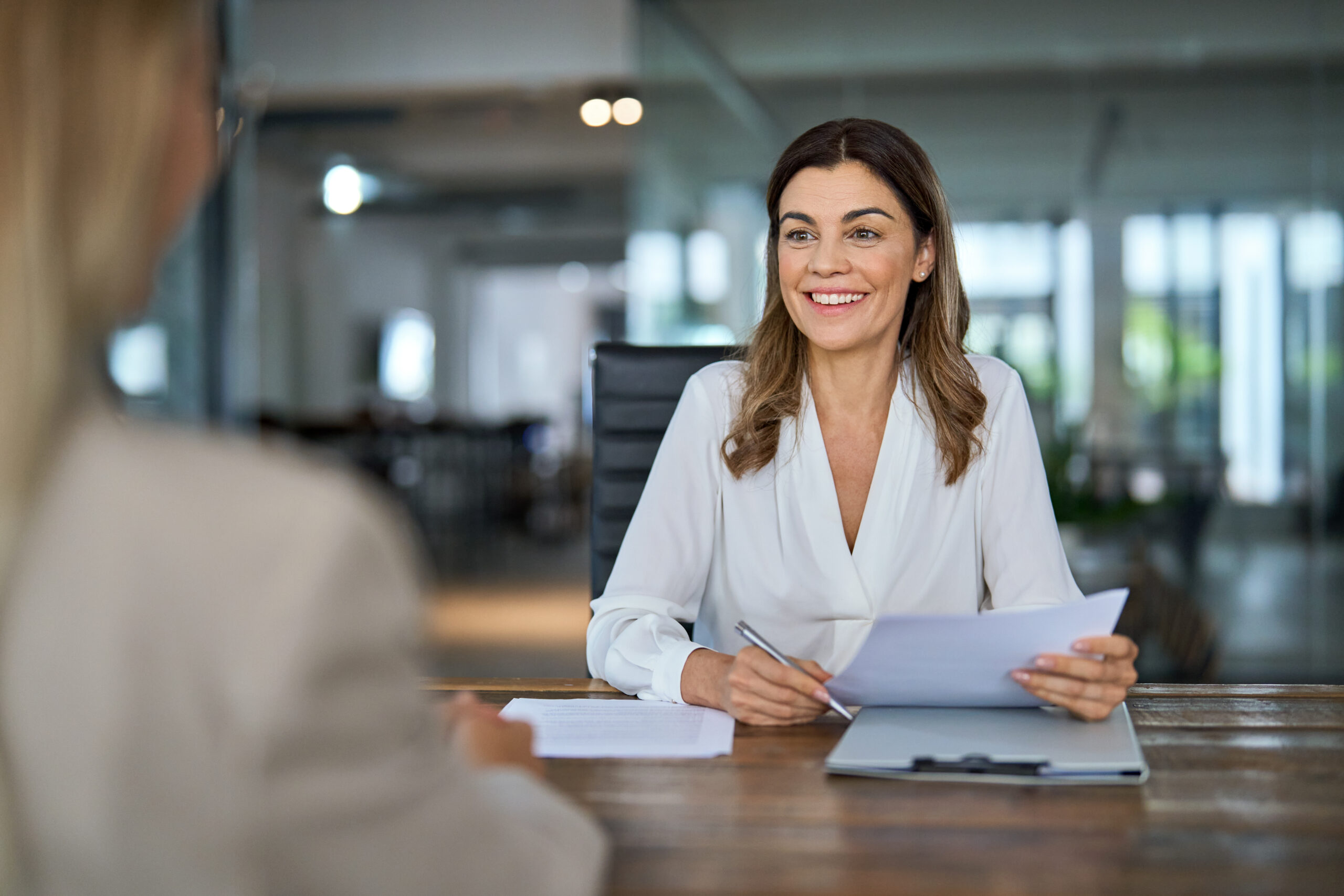 Happy mature business woman hr manager recruiter having job interview at office meeting.