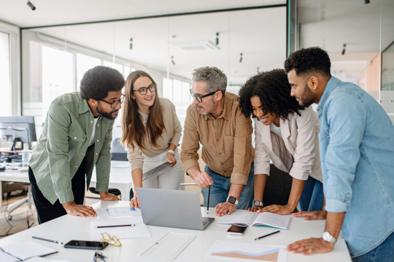 Creating a quarterly business strategy, Business professionals actively discussing ideas and strategies during a corporate meeting