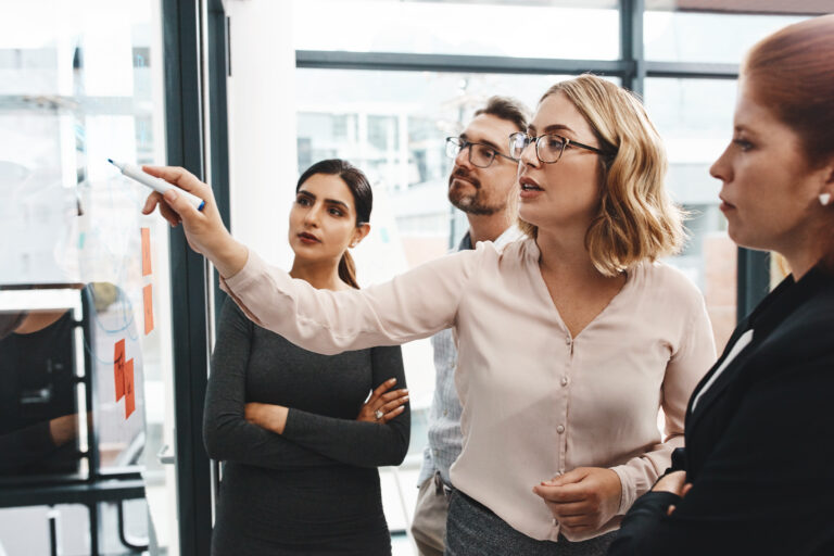 group and collaboration with notes on board with review, listening and planning with brainstorming, questions and discussion with strategy in office, keeping your company culture on track