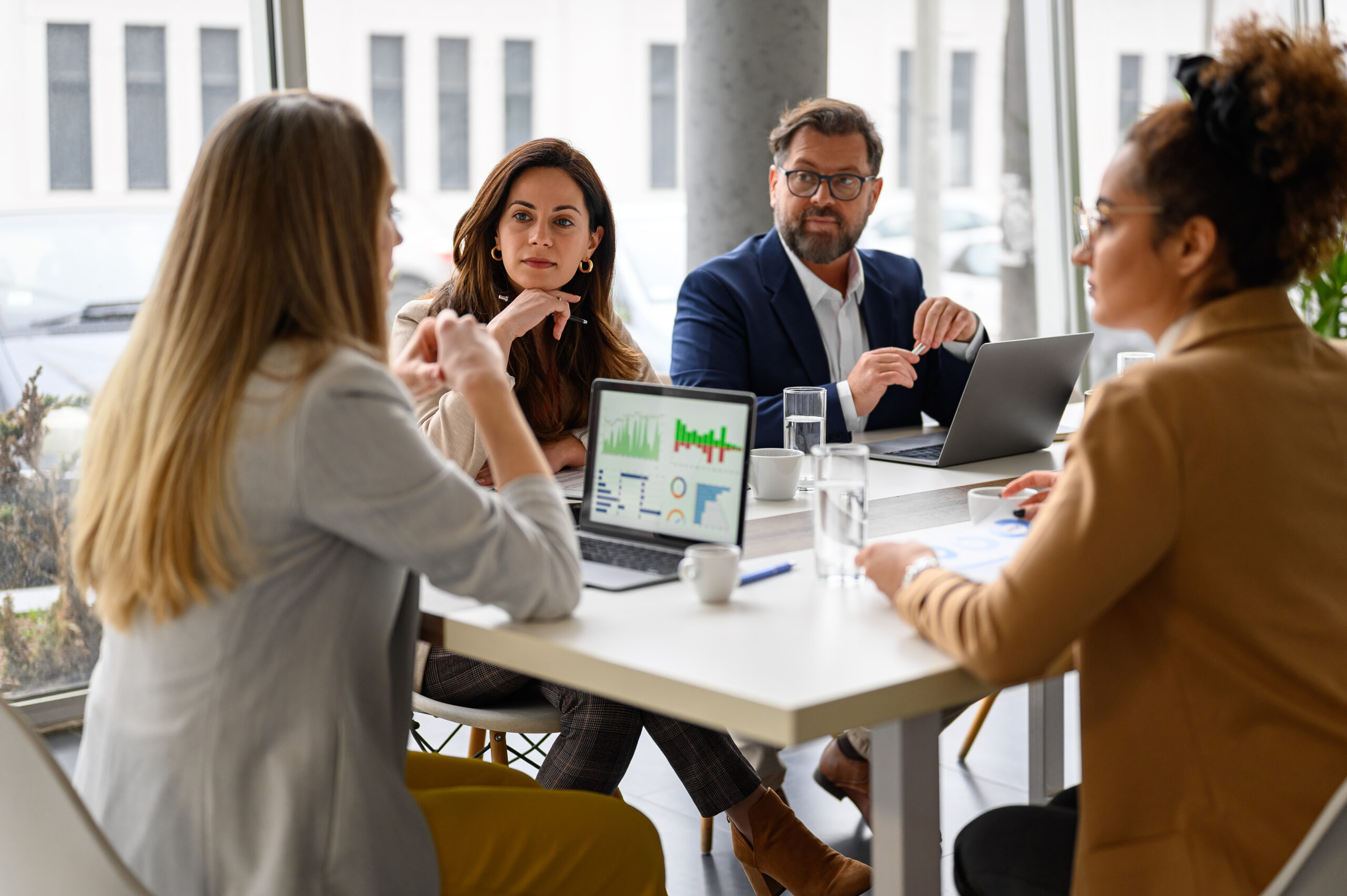 discussing business growth with coworkers in meeting, Ways to increase the sales