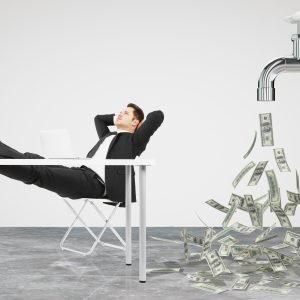 Businessman resting on a chair and faucet from which the money flow, control of your cash flow, cash position