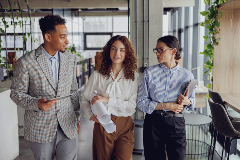 A diverse team of professionals actively discusses exciting ideas in a modern, contemporary office environment, Effective collaboration of business teams in the modern professional workspace environment, team culture